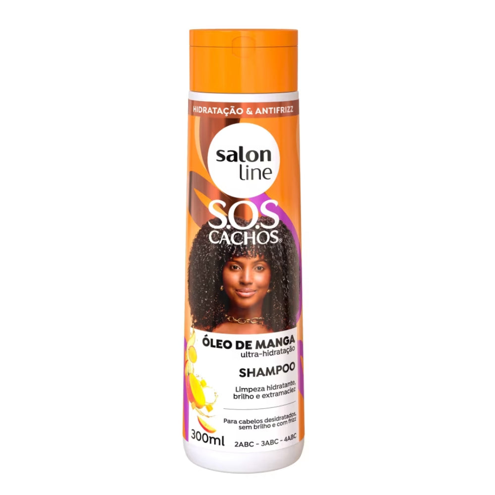 Shampoo Salon Line S.O.S Cachos Óleo de Manga 300mL, frasco e tampa laranjas. Com Óleo de Manga, proporciona limpeza hidratante, brilho e extramaciez para cabelos desidratados e com frizz.